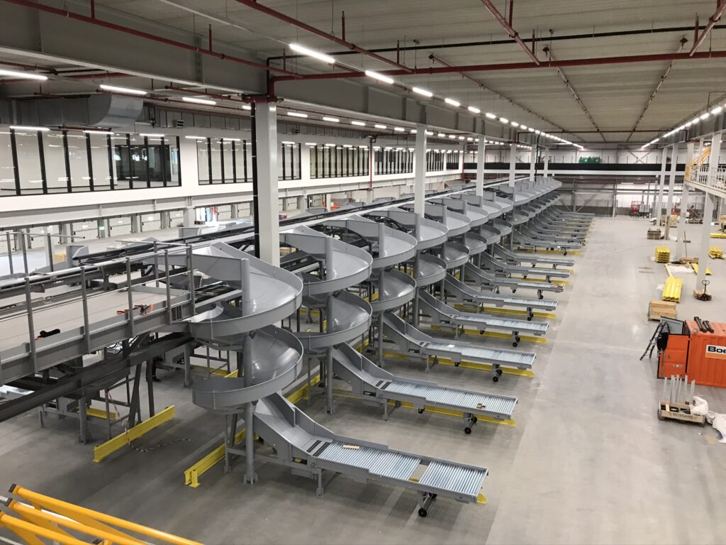 a large warehouse with conveyor belts